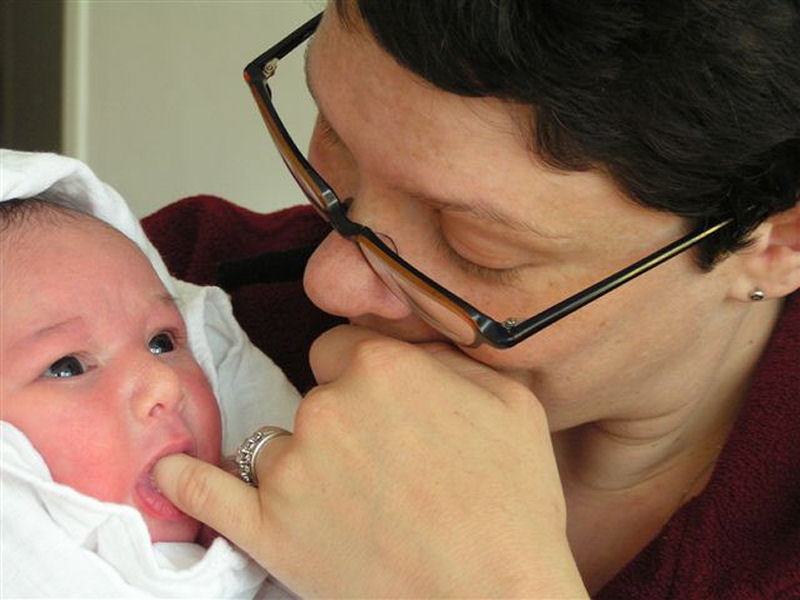 2005 05 14 Happiness is... Momma's finger in my mouth.