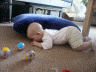 2005 09 11 Ruby has started making her first moves towards crawling.  She can get her bum up...