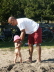 2006 06 11 Pap lifts Ruby at the beach..  Ow my back!  You're getting soooo heavy!