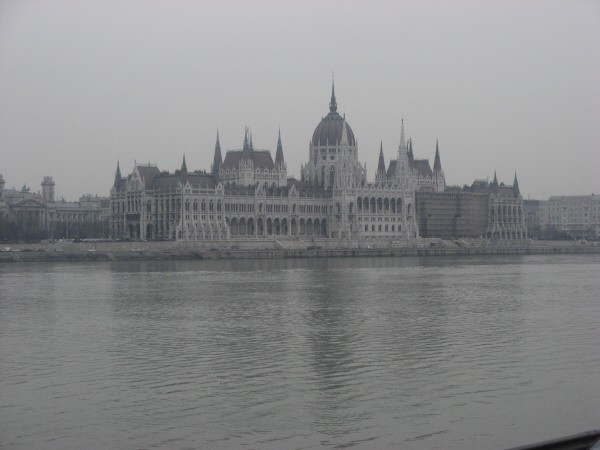2007 02 19 Budapest 02 Parliament Buildings.  Budapest is divided in two by the Danube river, seen here.  Buda is the hilly side and Pest is rather flat.