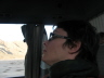 2008 01 08 Me terrified - The bus goes in a massive convoy.  Ours was relatively small, consisting of only 190-ish buses.  Here, Sara is foolishly watching the traffic.