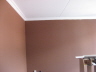 Crown Moulding is Up and needs paint and touch ups to wall