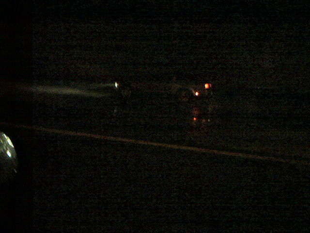Barely visible shot at night on the highway.